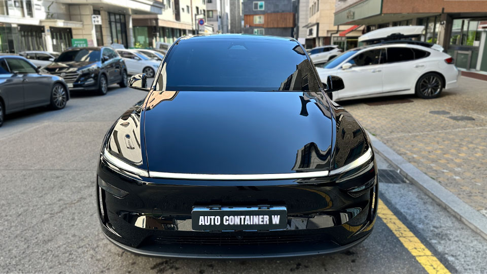 Black car photographed outside Solar Gard Noblesse Wirye, shown in Solar Gard's Vortex XR installation gallery.