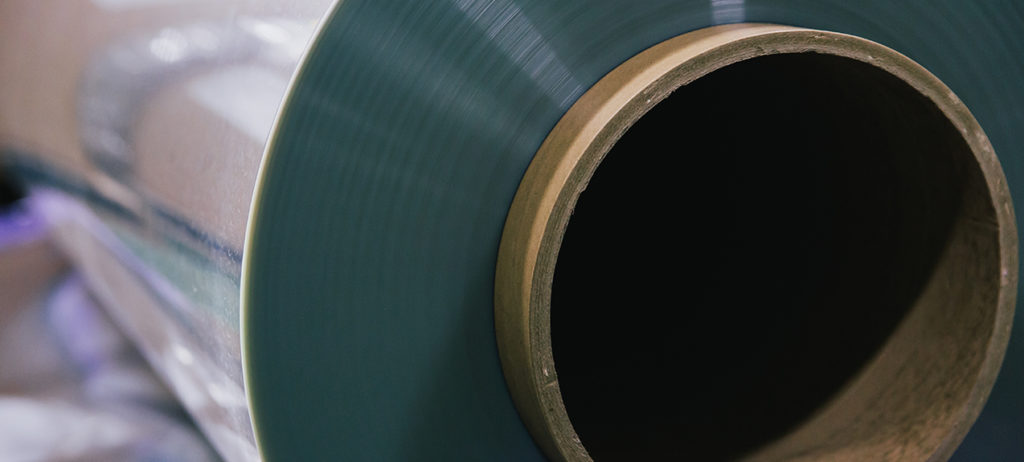 Large film roll wound around a cardboard core in Toray’s official solar-control materials photograph.